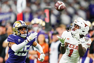 In this Jan. 1 file photo, Texas wide receiver Xavier Worthy makes a catch during a College Football Playoff semifinal game against Washington in New Orleans. (Associated Press)